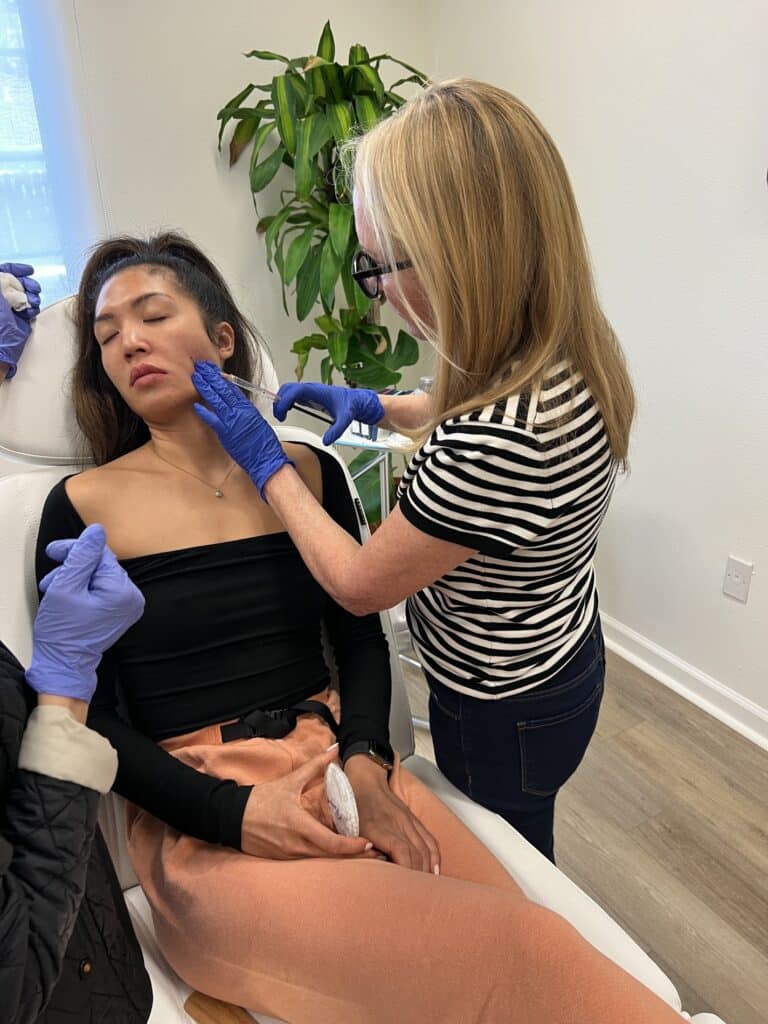 Young Woman During Dermal Filler Facial Treatment | San Carlos IV Bar in California